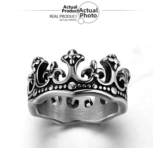 Detail view of crown ring with retro silver finish and intricate carved textures