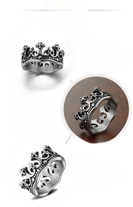 Detailed views of vintage silver crown ring in polished stainless steel for men