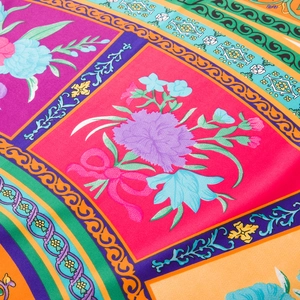 Detailed macro view of retro floral and European patterns on smooth satin silk scarf