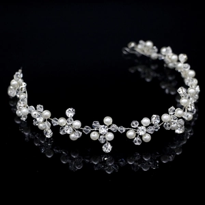 Handmade bridal headband with white pearls and crystals on a silver wire frame