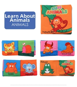 Detail showing colorful fabric baby books with 3D animal tails and English animal names