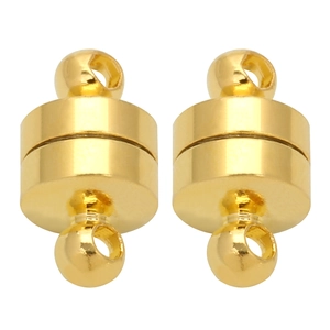 Macro view of gold cylindrical magnetic clasps with dual connection rings for jewelry