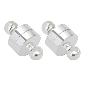 Macro shot of silver cylindrical magnetic jewelry clasps with metal rings for DIY jewelry