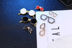 Detail of colorful enamel glasses pins and alloy frames for men suits and doll accessories