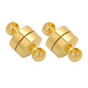 Close-up of golden magnetic jewelry clasps for necklace and bracelet connection