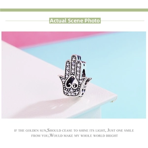 Macro detail of S925 sterling silver Hamsa Hand charm with hollow heart and S925 stamp
