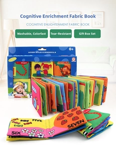 Close-up of durable baby cloth books in a gift box with colorful sensory animal tails