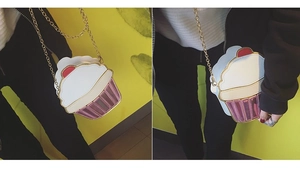 Macro view of creative cupcake shaped crossbody bag with gold chain and pink details