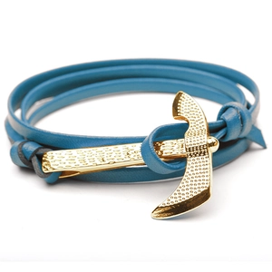 Detail of multi-layer blue leather wrap bracelet with golden anchor metal clasp