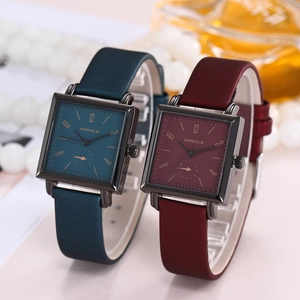 Detail of elegant square dial watches with premium navy and burgundy leather straps