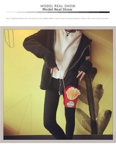 Model showcasing a creative red French fries shaped crossbody bag with gold chain strap
