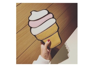 Detailed view of an ice cream shaped crossbody bag with quilted waffle cone texture