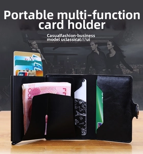 Detail of black pebbled leather card holder with multiple slots and secure snap closure