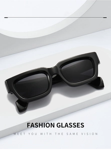 Detailed macro view of black rectangular sunglasses with thick frames and premium finish