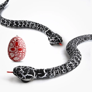 Realistic infrared remote control snake toy with egg-shaped transmitter on white background
