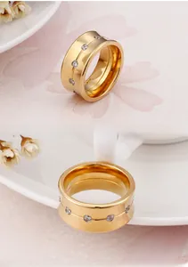 Macro detail of 10mm gold plated titanium ring featuring embedded sparkling zircon crystals
