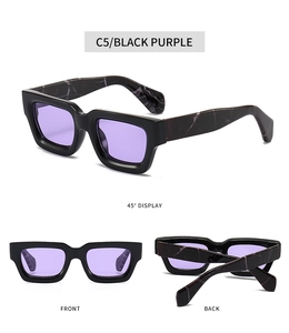 Detail view of retro square thick black frame sunglasses with purple lenses and marble arms
