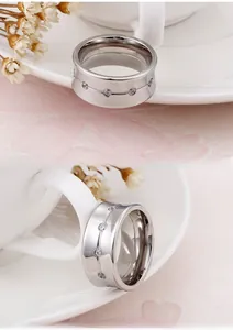 Detailed view of silver titanium steel ring with sparkling round cubic zirconia stones