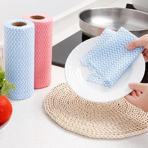 Disposable blue and pink wavy non-woven kitchen cleaning cloths in rolls for dish washing