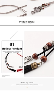 Close-up of ethnic braided waist rope with hollow metal pendant and tassel detail