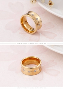 Macro shot of 18K gold plated titanium ring featuring a 10mm band with circular zircon stones
