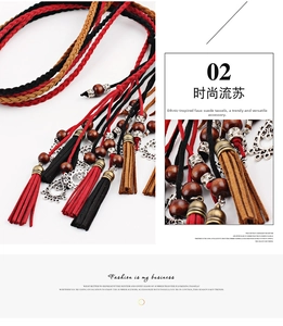 Detail of hand-woven ethnic waist rope with tassels, wooden beads and floral pendants