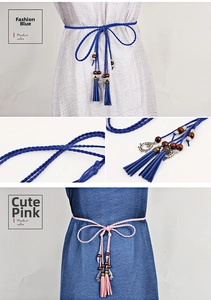 Detail of hand-woven waist ropes with tassels, wooden beads and hollow metal pendants