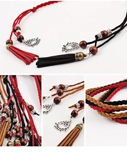 Detail of hand-woven suede waist belts with tassels, wooden beads and hollow metal charms