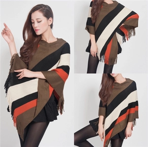 Women's knit poncho with colorful stripes and tassels in a stylish pullover design