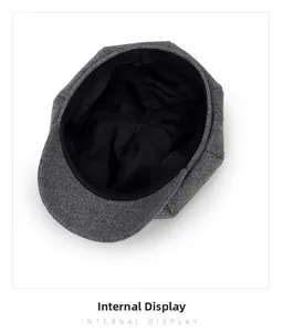 Detailed internal display showing black lining and dark grey wool newsboy cap texture