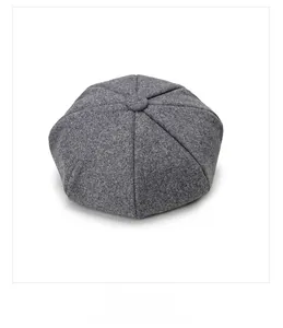 Detail view of the gray textured wool newsboy cap showing back display and stitched crown