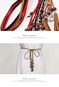 Detail of hand-woven tassels and bohemian beads on a multi-colored ethnic waist rope