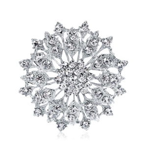 Detailed close-up of butterfly brooch with sparkling crystals and silver finish