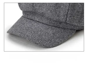 Detail of dark grey wool octagonal newsboy hat showing thick texture and sturdy brim