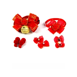 Detail of red festive pet bow tie with gold Fu character and bell for New Year