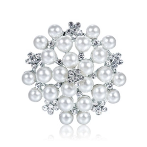Close-up of elegant flower brooch with white pearls and sparkling crystals detail