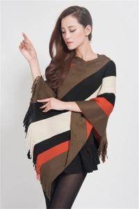 Close-up of multicolor striped knit poncho sweater featuring decorative tassel hem