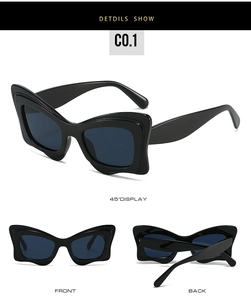 Gros plan sur les lunettes papillon noires avec monture ondulée et verres gris-bleu