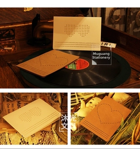 Detail of vintage heart and spectacles hollow cut-out DIY kraft paper cards with envelopes