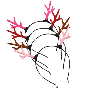 Set of four plush reindeer antler headbands in pink, red, and brown on white background