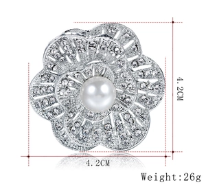 Silver flower brooch detail showing 4.2cm size measurement and 26g weight with pearls