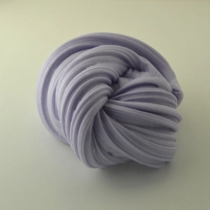 Macro detail of purple fluffy slime showing stretchy texture and soft clay consistency