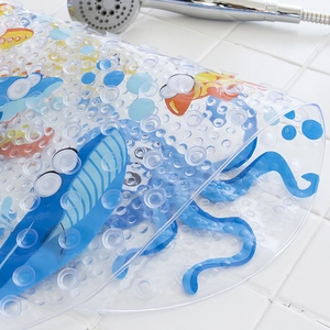 Close-up of flexible PVC bathroom mat with blue octopus print and powerful suction cups