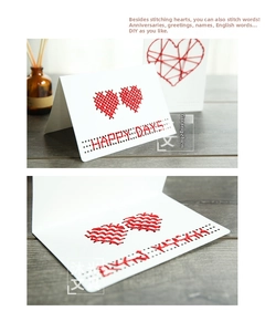 Detail of DIY cross stitch greeting card with red heart and Happy Days embroidery
