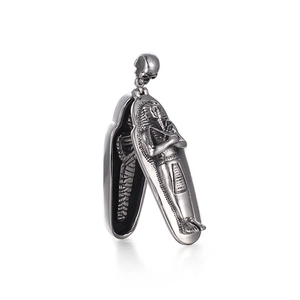 Vintage stainless steel Egyptian Pharaoh mummy pendant with skull bail and openable lid