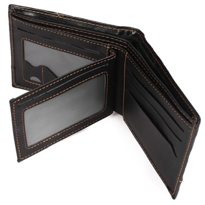 Detail of slim men's leather wallet featuring dual transparent ID windows and card slots