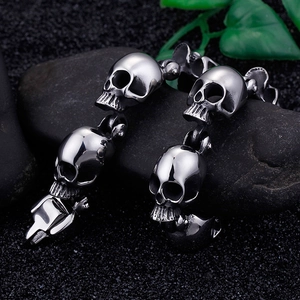 Gothic punk skull head bracelet in high-polished stainless steel on rocky background