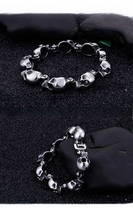Macro view of detailed gothic skull bracelet links in vintage silver stainless steel