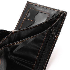 Detail view of black men's wallet with orange stitching, card slots, and zipper compartment