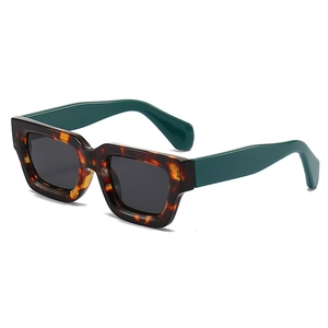 Retro thick square tortoise shell sunglasses with dark green temples on white background